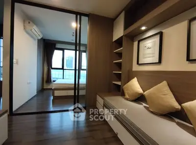 Modern apartment with cozy seating and bedroom view