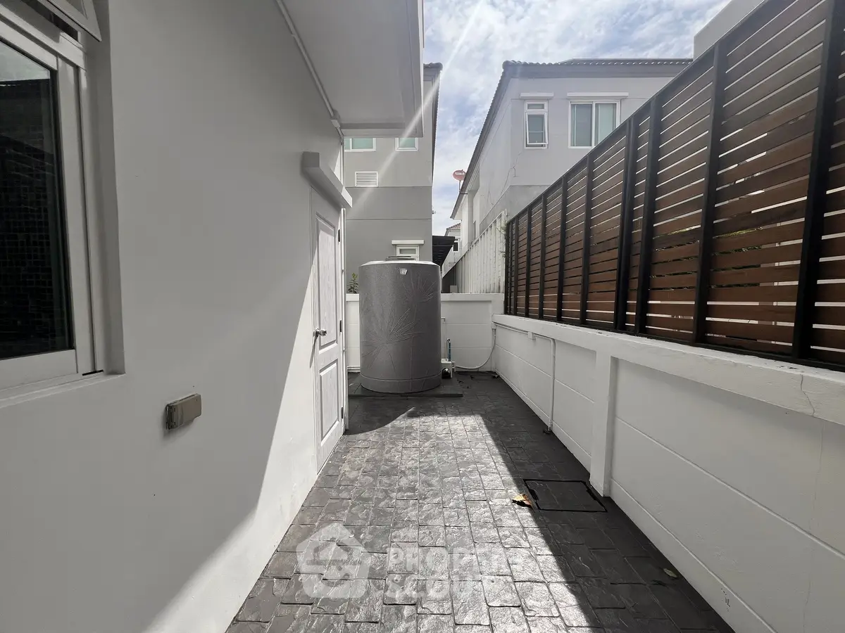 Modern exterior patio with sleek design and privacy fence