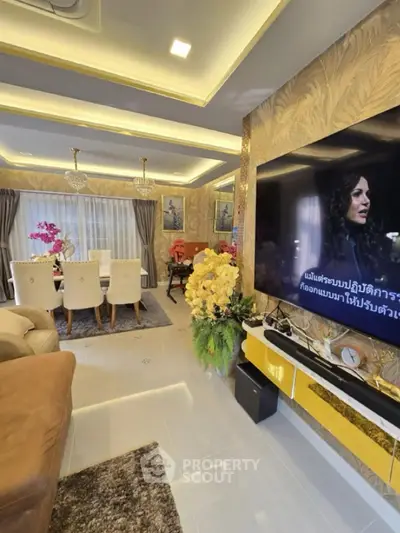 Luxurious living room with elegant dining area and large TV