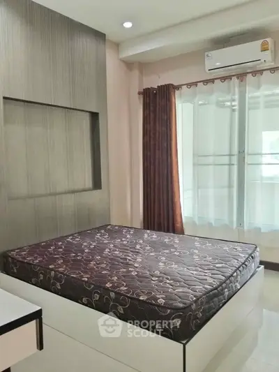 Modern bedroom with built-in air conditioning and stylish decor