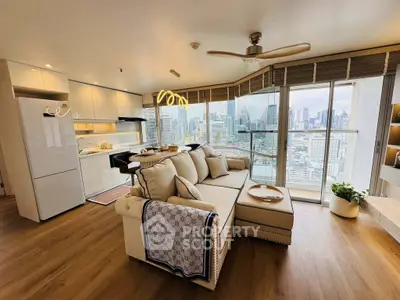 Luxurious open-plan living room with stunning city view and modern kitchen.