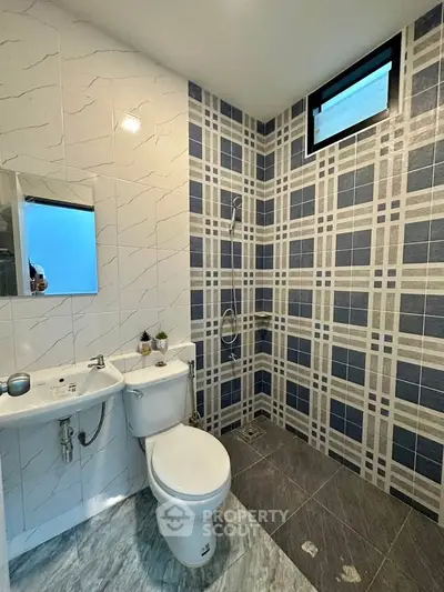 Modern bathroom with stylish tile design and sleek fixtures