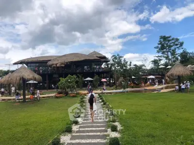 Charming eco-friendly resort with lush greenery and thatched-roof architecture, perfect for nature lovers.