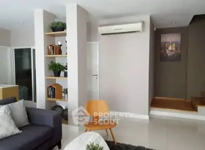 Modern living room with stylish decor and air conditioning