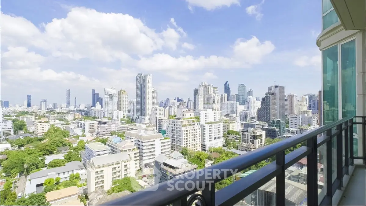 Stunning cityscape view from a modern balcony in a high-rise apartment.