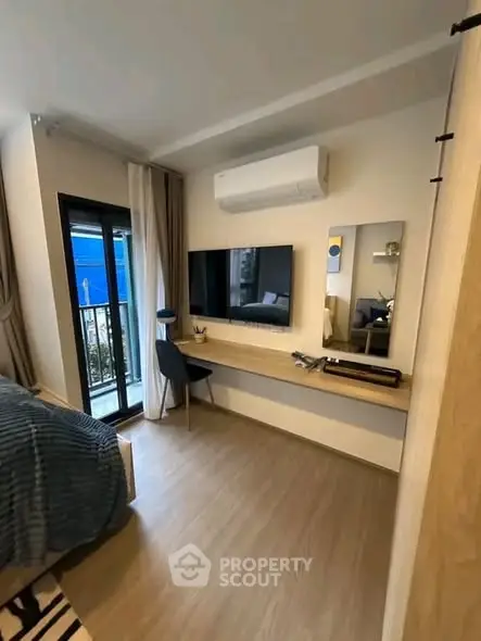Modern bedroom with balcony access and sleek interior design