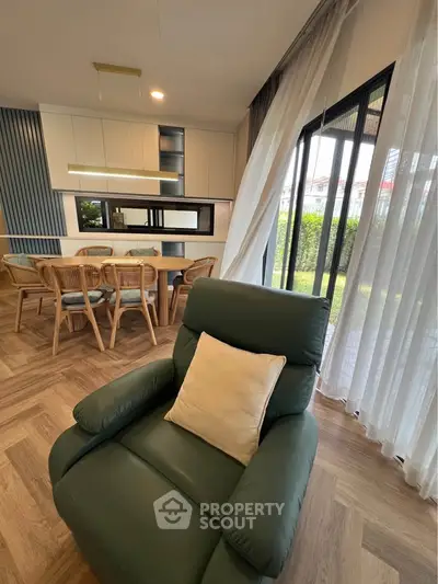 Stylish living room with elegant dining area and garden view
