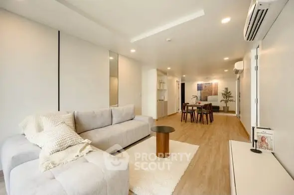 Spacious modern living room with elegant decor and open layout, perfect for relaxation and entertaining.
