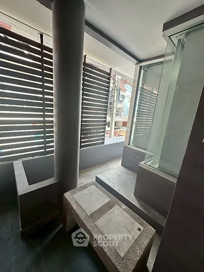 Modern balcony with sleek design and urban view