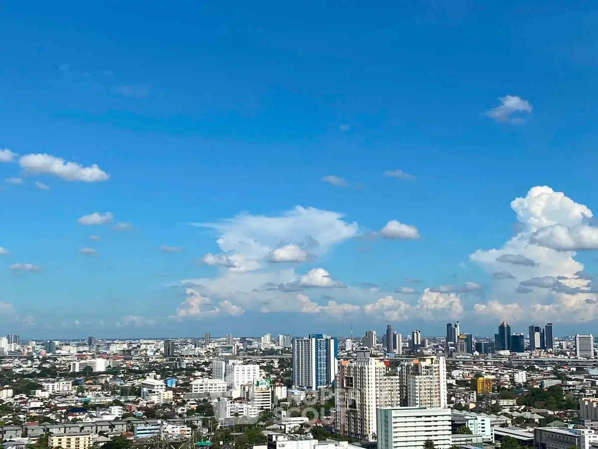 Stunning cityscape view with clear blue skies and modern skyline, perfect for urban living enthusiasts.