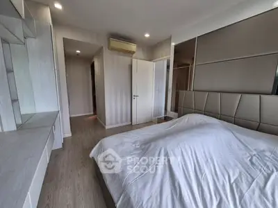 Modern bedroom with sleek design and ample natural light