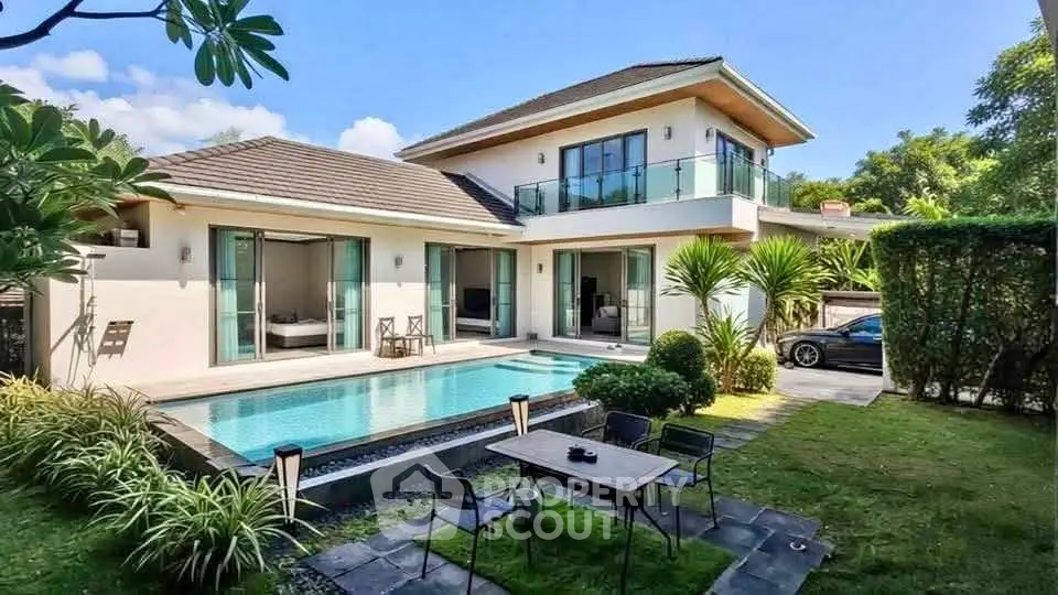 Luxurious modern villa with private pool and lush garden, perfect for serene living.