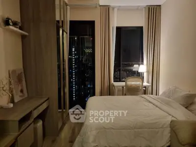 Cozy bedroom with city view, modern decor, and ambient lighting.