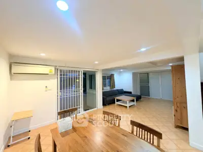 Spacious living room with modern furniture and open layout, perfect for family gatherings.