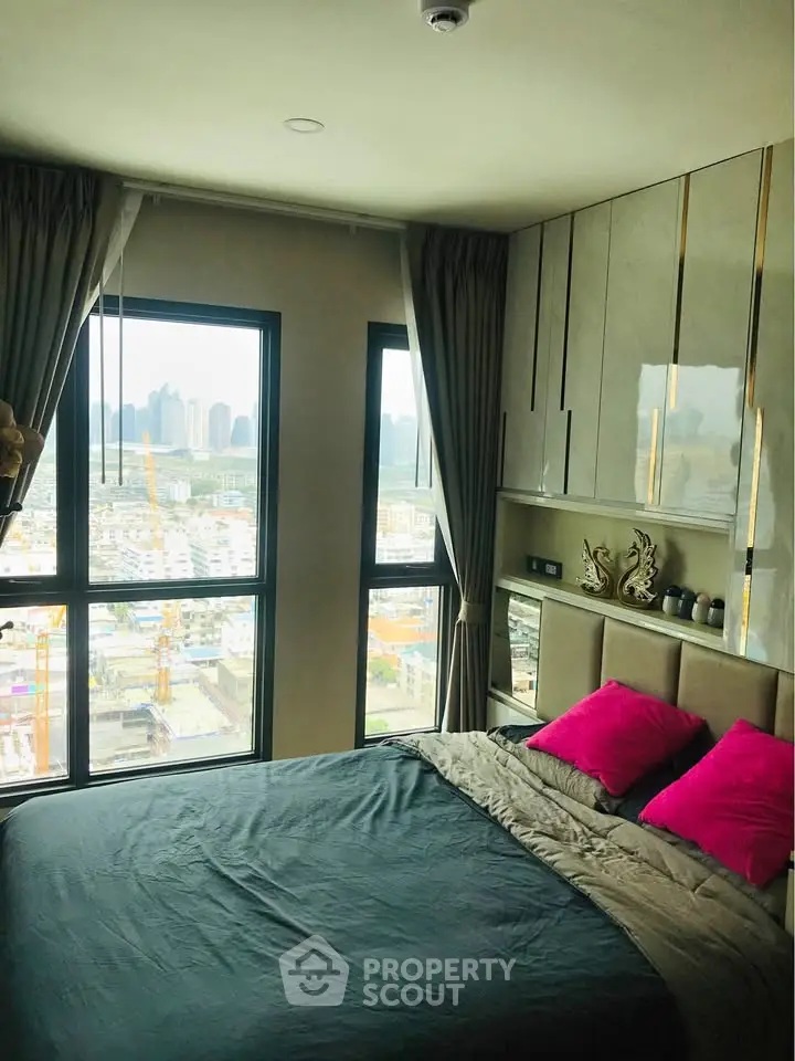 Luxurious bedroom with stunning city view and elegant decor