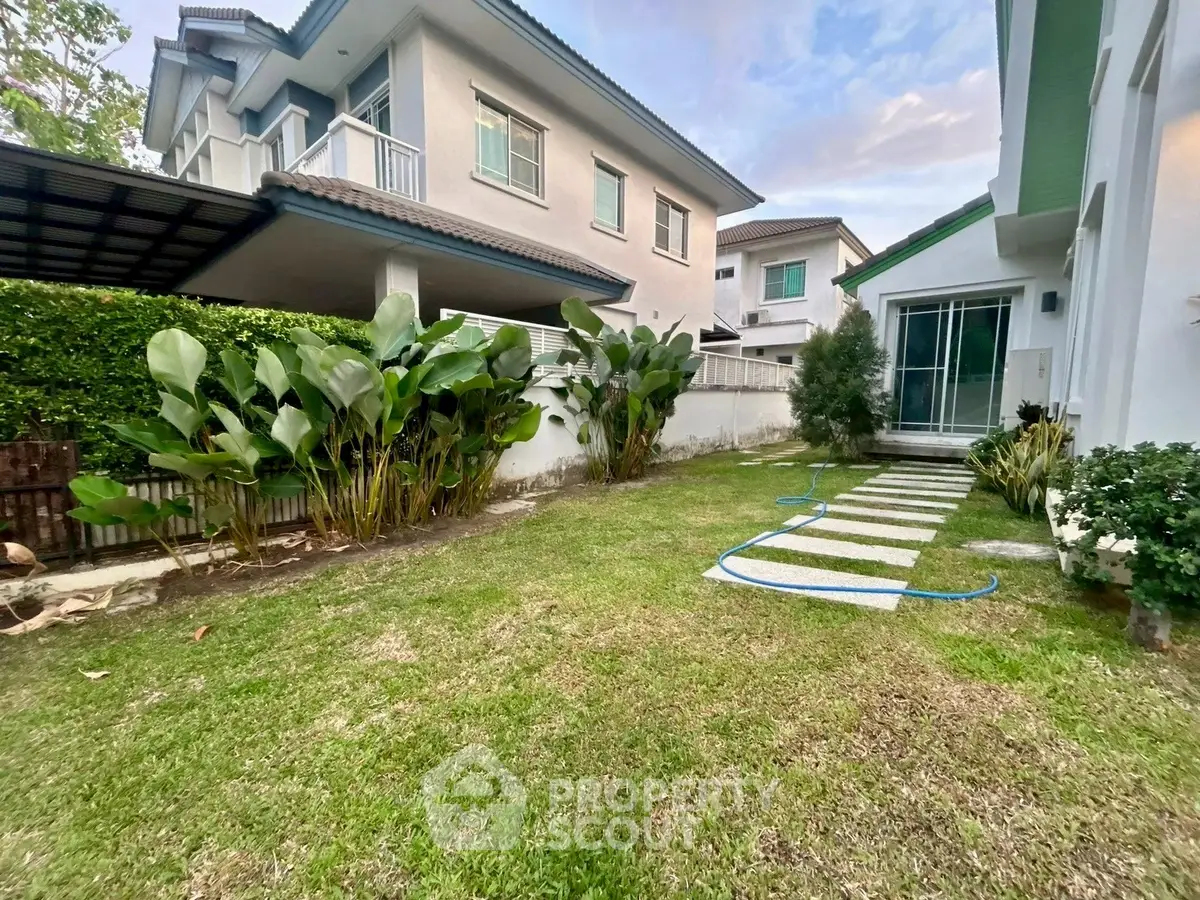 Charming suburban home with lush garden and modern exterior, perfect for family living.
