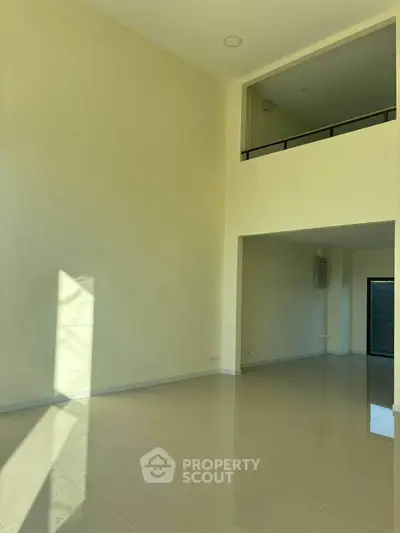 Spacious modern living room with high ceilings and natural light