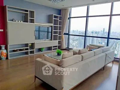 Spacious living room with panoramic city view and modern decor