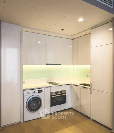 Modern kitchen with sleek cabinetry and built-in appliances