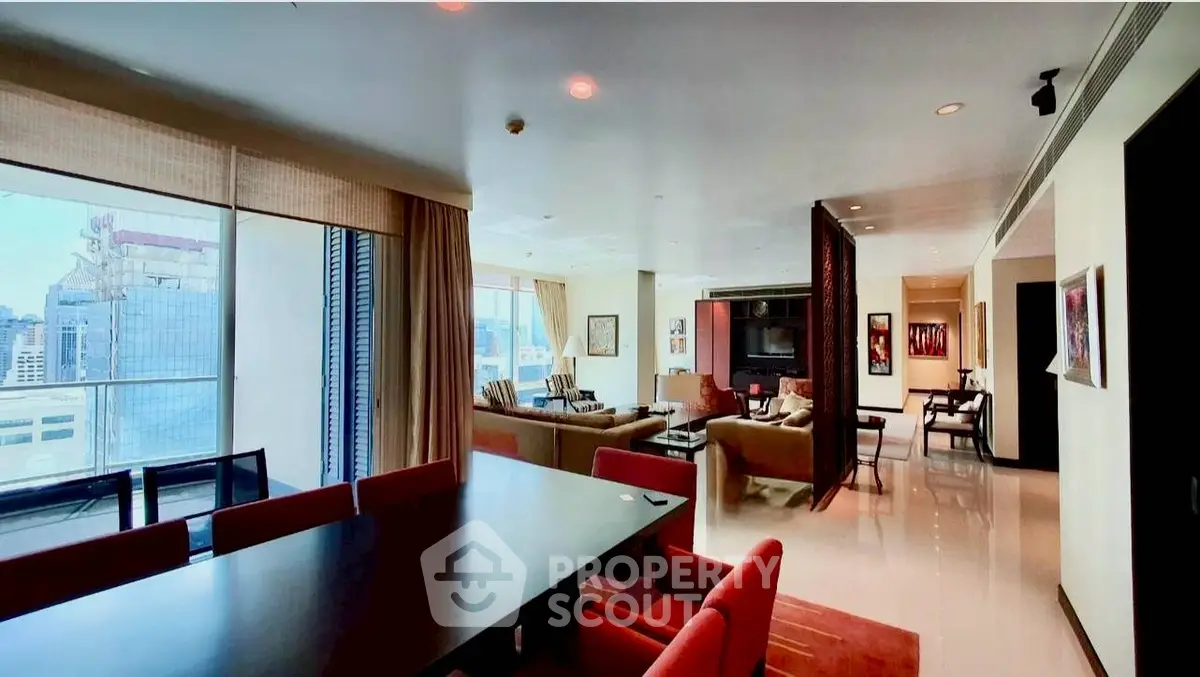 Spacious modern living room with city view, elegant dining area, and stylish decor in luxury apartment.