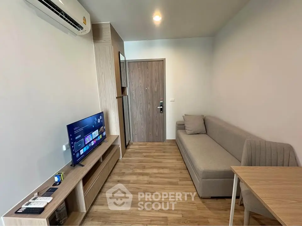 Modern living room with sleek furniture and wooden flooring