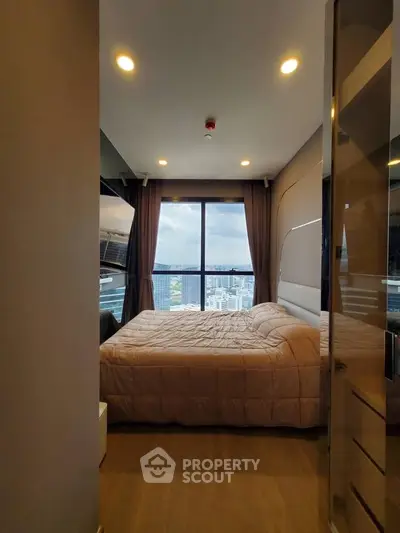 Modern bedroom with stunning city view and cozy ambiance