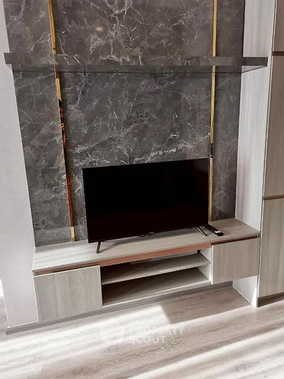 Modern living room with sleek TV stand and elegant marble accent wall