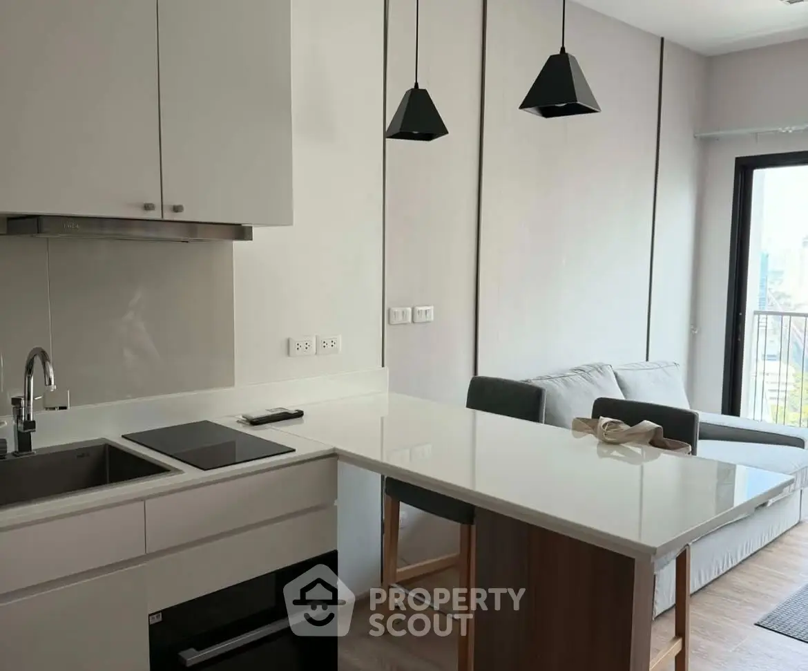 Modern open kitchen with sleek design and cozy living area