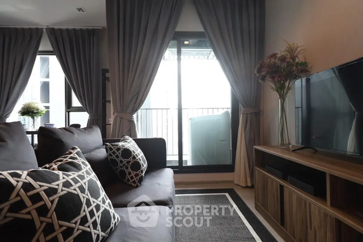 Stylish living room with modern decor and balcony access