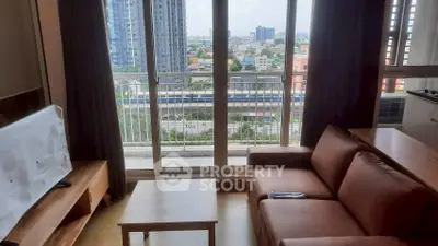 Modern living room with balcony view in high-rise apartment