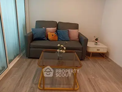 Cozy living room with modern sofa and glass coffee table