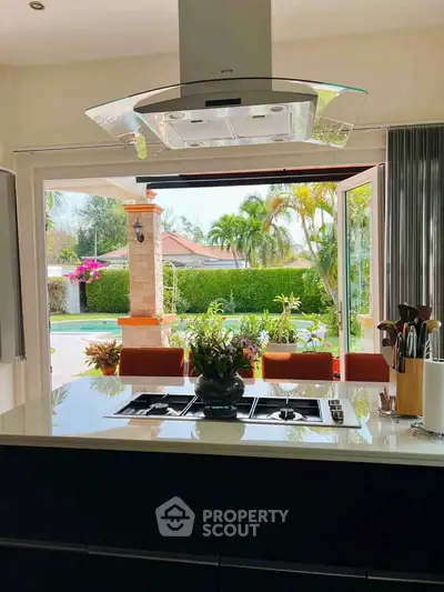 Luxurious kitchen with open layout and stunning garden view