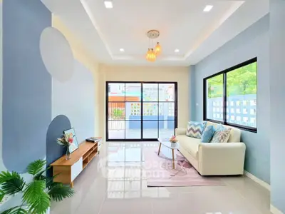Bright and modern living room with stylish decor and large windows offering natural light.