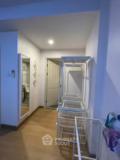 Spacious interior with wooden flooring and modern storage solutions