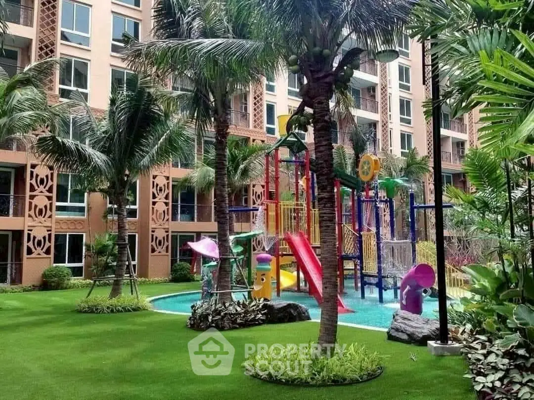 Luxurious condo with vibrant playground and lush garden view.