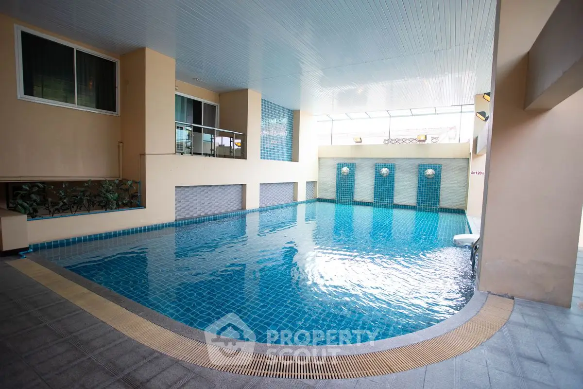 Luxurious indoor swimming pool with modern design and elegant finishes