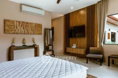 Luxurious bedroom with modern decor and wall-mounted TV