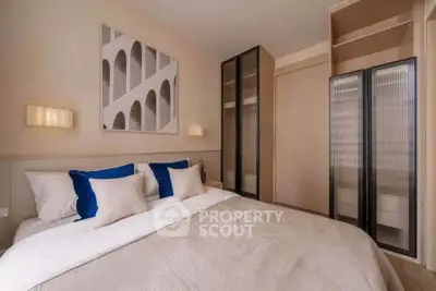 Elegant bedroom with modern decor and ample storage space