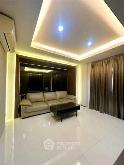 Modern living room with sleek lighting and comfortable seating