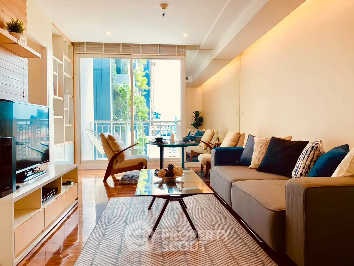Spacious modern living room with stylish decor and balcony view