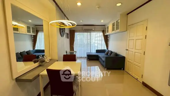 Modern living room with sleek furniture and large window for natural light