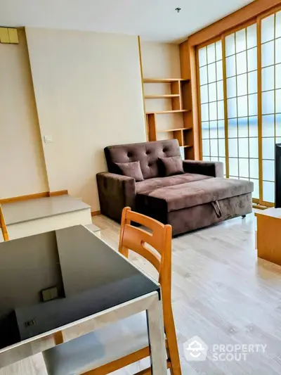 Modern living room with stylish brown sofa and wooden accents