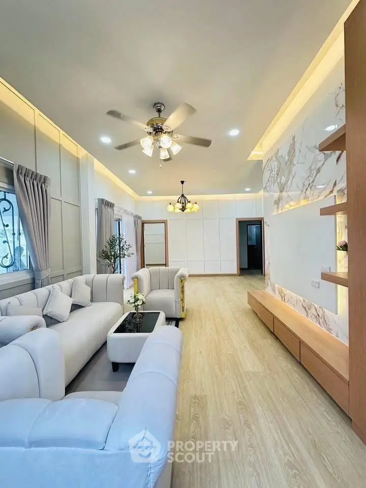 Spacious modern living room with elegant decor and natural light