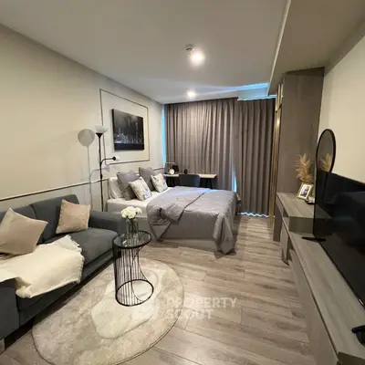 Modern studio apartment with cozy living area and stylish decor