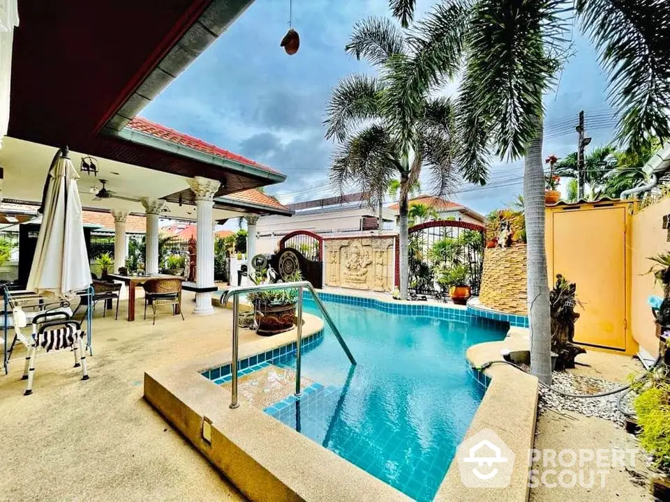 Stunning tropical backyard with private pool and lush landscaping for ultimate relaxation.