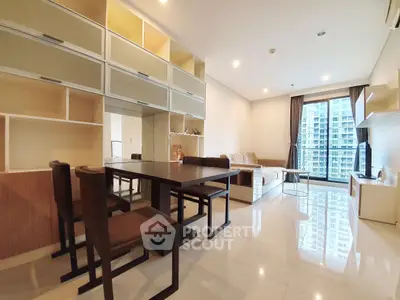 Spacious modern living room with elegant furniture and city view, perfect for urban living.