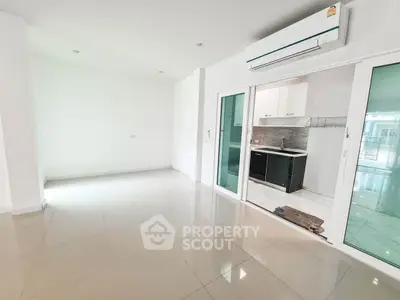 Spacious modern apartment with sleek kitchen and air conditioning