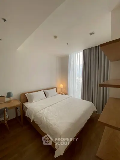 Cozy bedroom with modern wooden furniture and soft lighting