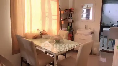 Cozy dining area with natural light and modern decor