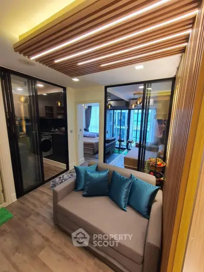 Modern living room with stylish ceiling design and cozy seating area